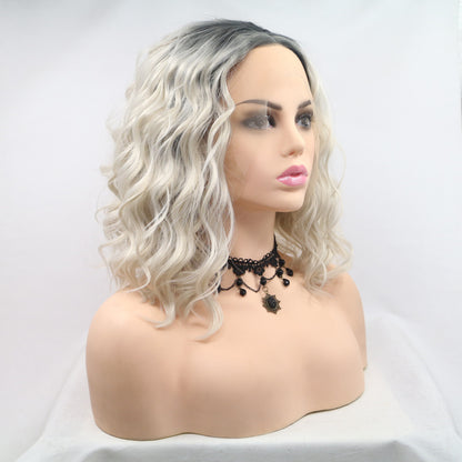 front lace blonde shoulder length wig with platinum blonde icy hair and a dark shadow root.